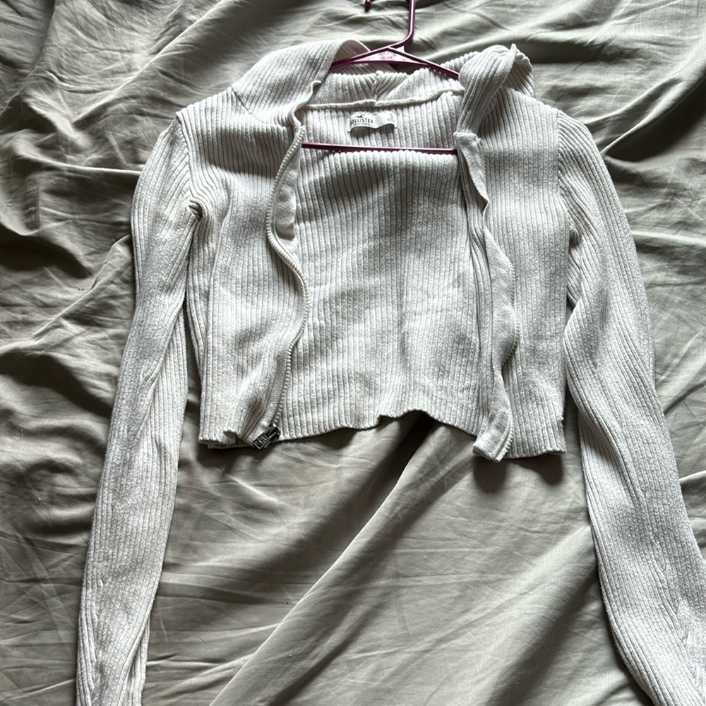 White Hollister zip up sweater.